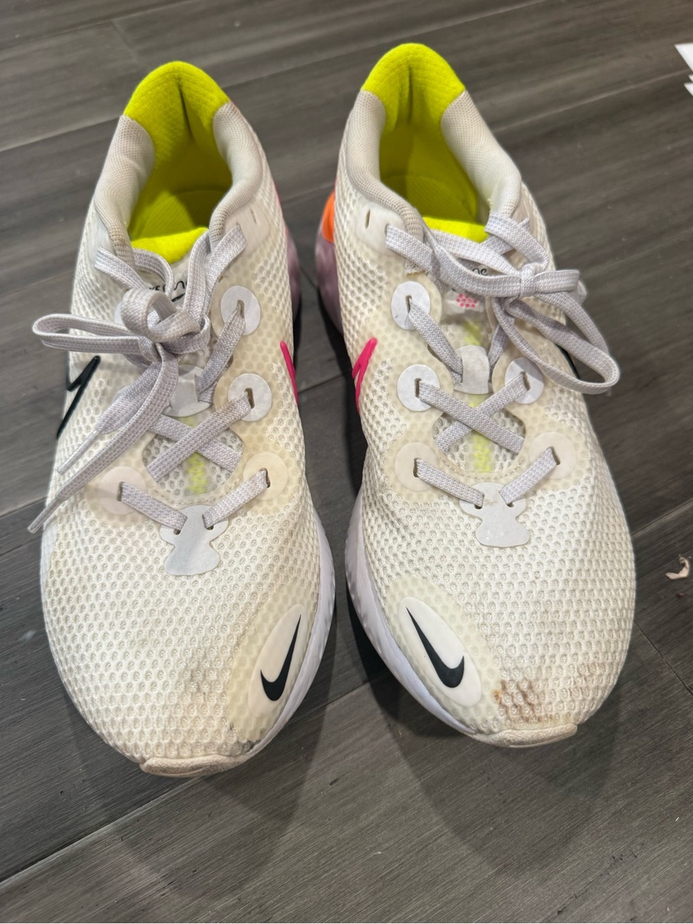 Nike Woman’s White Mesh Sneakers with Neon Yellow Lining and Pink Accent